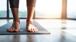 person doing yoga position in sunlit